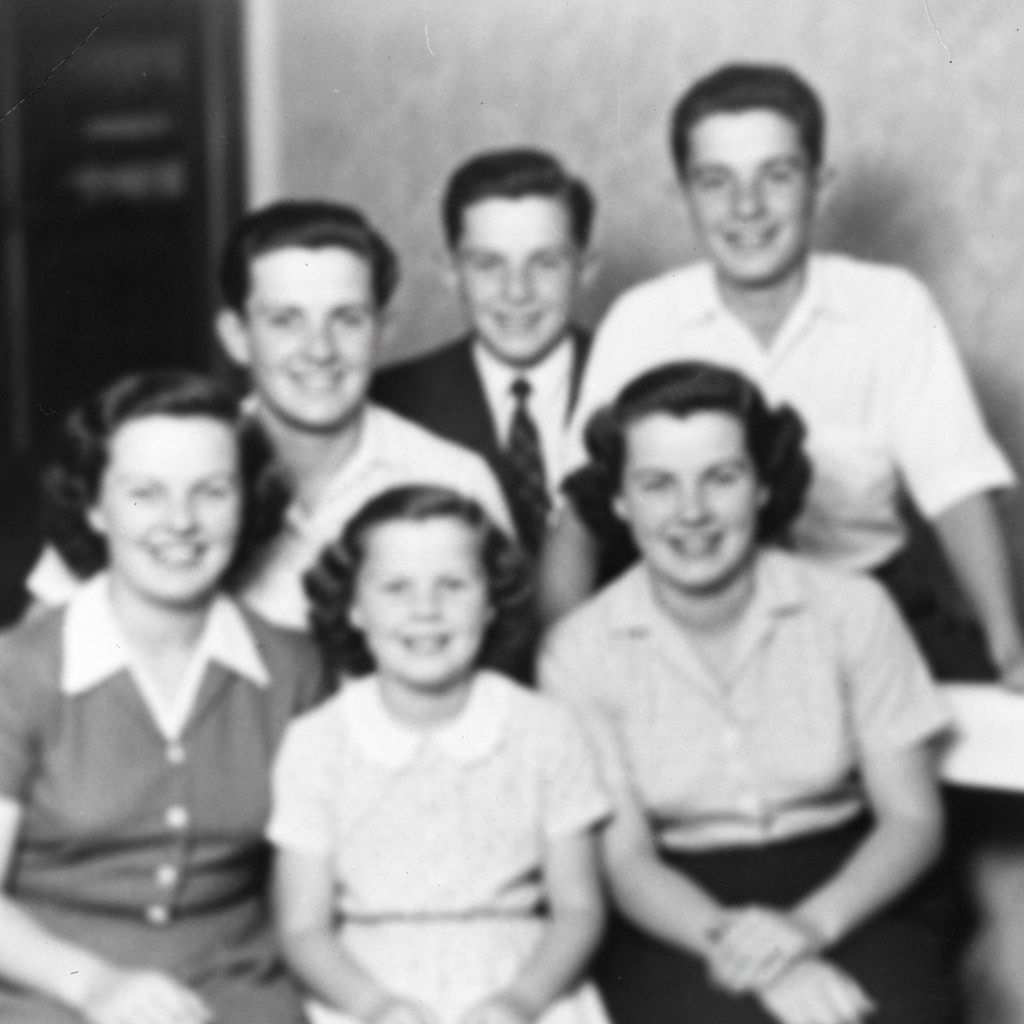 Low resolution vintage family photo from 1950s